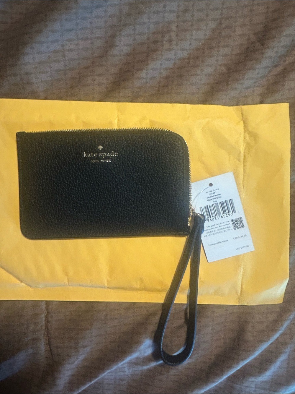kate spade black pebbled leather wristlet with gold hardware